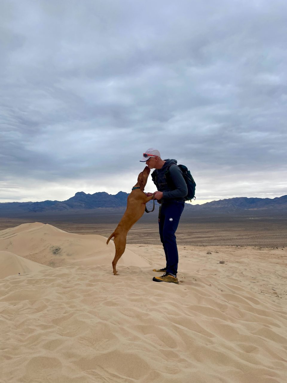 Tim and his dog Minka (a Hungarian Vizsla) at the Kelso Dunes in Mojave National Preserve.