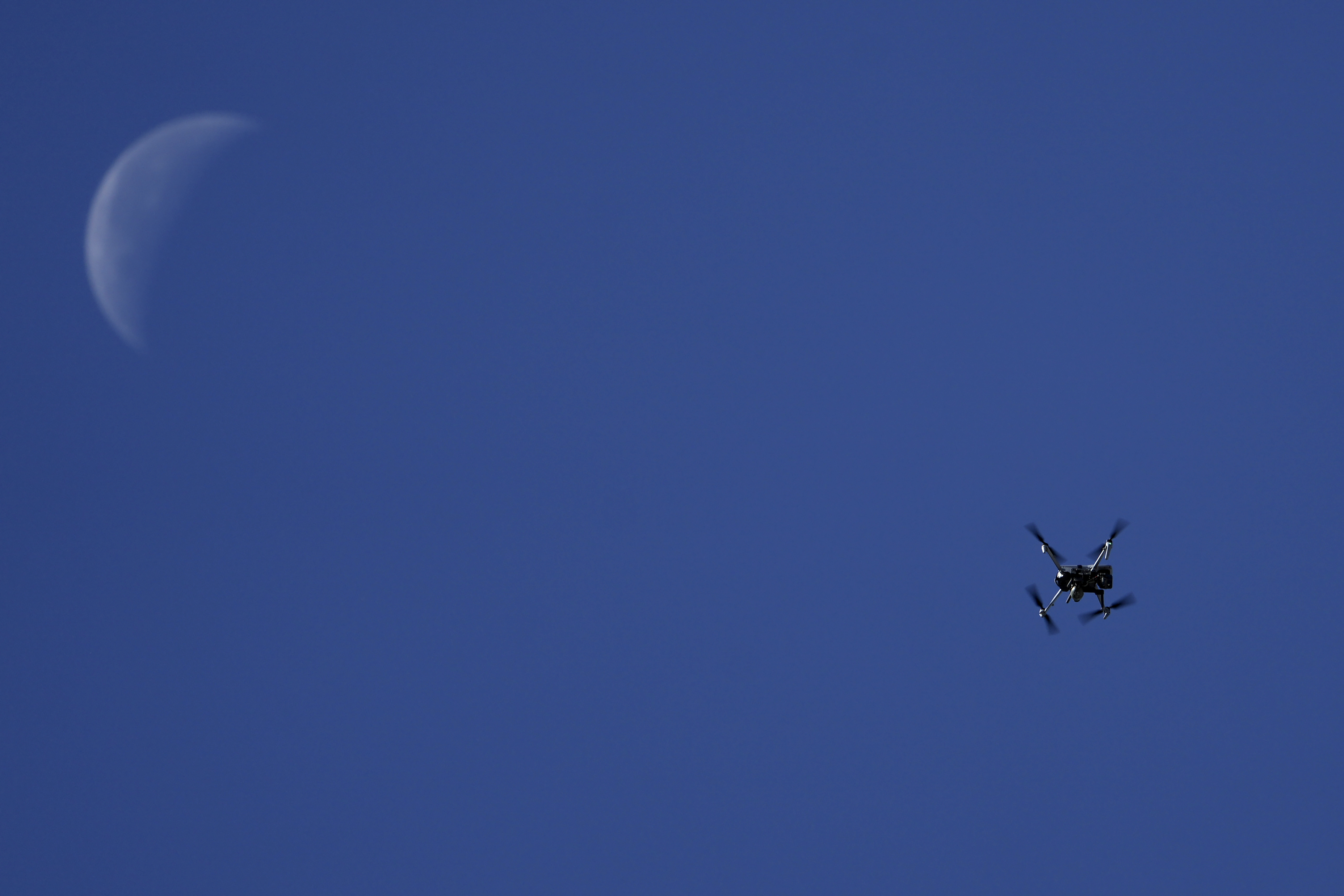 A drone flies overhead as Israeli forces operate in the Balata refugee camp, in the West Bank city of Nablus, Saturday, June 1, 2024. The Israeli military said that its forces conducted counterterrorism activity in the area overnight. (AP Photo/Majdi Mohammed)